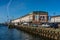 View of famous Boston Fish Pier located in Boston Harbor with fishing boat moored to the wharf wall