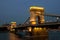 View of the famous chain bridge in Budapest at night.