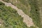 View of the famous llama terraces with white stone llamas in Choquequirao archeological site ruins, Peru