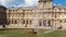 View of famous Louvre Museum with fountains in courtyard of Louvre Palace in a sunny morning, Paris, France.