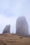 View on famous rock Roque Nublo in fog on the Canary Island Gran Canaria, Spain.