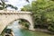 View of the famous Steinerner Steg / Ponte Romano bridge, a two-arched, stone-built footbridge across the Passer in Merano, South