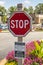 View of a fancy wooden stop sign frame and pole