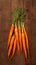 view Farm fresh baby carrots on a wooden cutting board, ready to enjoy