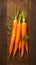 view Farm fresh baby carrots on a wooden cutting board, ready to enjoy