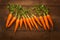 view Farm fresh baby carrots on a wooden cutting board, ready to enjoy