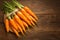 view Farm fresh baby carrots on a wooden cutting board, ready to enjoy