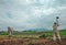 View of Farmers Plowing Rice Fields