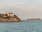 View of Faro de La Cerda on the edge of a waterside cliff in the evening