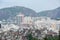 View of `Favela`, high-rise buildings and part of Sugarloaf Mountain int he background