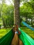 View of feet with orange boots on a hammock. Relaxation and sere