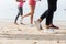 View Of Feet Running On Beach Together Closeup Of Sport People Runners Jogging Working Out Team Training Together