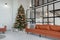 View on Festive Christmas New year decoration in a modern loft interior with black windows and kitchen