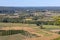 View of fields and meadows in the Dordogne Valley from the walls of the old town of Domme