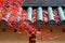 View of fiery autumn foliage and fallen leaves on the eaves of a Japanese temple in a peaceful, zen-like atmosphere