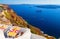 View in Fira on cafe overlooking the Caldera and cruise ship at sea. Santorini, Greece