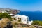 View of Fira town - Santorini island,Crete,Greece. White concrete staircases leading down to beautiful bay