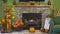 View of a Fireplace With a Fire, all Decorated for Autumn With Pumpkins, Scarecrows and Fall Leaves.