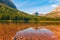 View of Fishercap Lake and the surrounding mountains in autumn.Glacier National Park.Montana