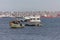 View of fishing boats on the coast of Luanda city, Luanda Bay, with Port of Luanda, transport ships and containers in the
