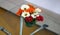 View of flowers in vase on a glass top table and sofa in trade show stall