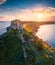 View from flying drone. Aerial spring view of Milazzo lighthouse. Gorgeous morning scene of Milazzo peninsula. Stunning sunrise on