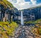 View from flying drone. Breathtaking morning view of famous Svartifoss Black Fall Waterfall. Exotic summer scene in Skaftafell,