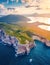 View from flying drone. Coloful sunrise on Caccia cape. Awesome spring scene of Sardinia island, Italy, Europe. Fantastic morning