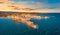 View from flying drone. Exciting evening cityscape of Vieste - coastal town in Gargano National Park with Castello Svevo, Italy, E