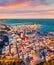 View from flying drone. Fantastic morning cityscape of Vieste - coastal town in Gargano National Park, Italy, Europe. Coloful spri