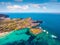 View from flying drone. Incredible summer view of Falcone cape and Torre della Pelosa tower. Wonderful morning scene of Sardinia i