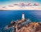 View from flying drone. Picturesque morning view of di Capo Ferro Lighthose. Amazing spring sunrise on Sardinia island, Italy, Eur