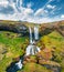 View from flying drone. Picturesque morning view of Sheep`s Waterfall. Amazinf summer scene of Iceland, Europe.