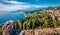 View from flying drone. Sunny morning view of Taormina town and Etna volcano on background. Splendid spring seascape of Mediterran