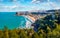 View from flying drone. Sunny summer cityscape of Peschici town, Province of Foggia, Italy, Europe. Brighjt morning seascape of Ad