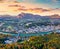 View from flying drone. Unbelievable morning cityscape of Salzburg, Old City. Spectacular autumn sunrise on Eastern Alps. Aerial l