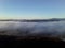 A View of Fog Rolling in the Valley at Dawn