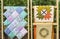 View of folded Quilts On Wooden Stand