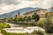 A view of Foligno, crossed by the river Topino, a bell tower rises above the roofs of the houses