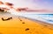 View on Foodsteps and sunset on the beach by Tayrona in Colombia