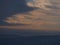 View of the foothills of Swabian Alb, Germany with the silhouettes of famous Hohenzollern Castle below brightening sky.