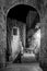 View of a foreshortening through an arch in San Gimignano in Tuscany by night