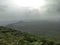 The view of a forest and green plants and rain bearing clouds in monsoon season from a mountain in indore india