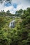 View of forest with waterfall and cliffs in a cloudy day near, Campos de JordÃ£o.