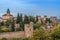 View of fortified buildings of Alhambra palace complex and Albaicin district from Jardines del Generalife gardens