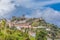 View of the fortress and Luso Roman castle of Ã“bidos, with buildings of Portuguese vernacular architecture and sky with clouds,