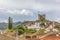 View of the fortress and Luso Roman castle of Ã“bidos, with buildings of Portuguese vernacular architecture and sky with clouds,
