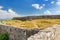 View of Fortress Rozafa near Shkodra city in amazing valley among mountains in Albania. Ancient stone walls and towers of bastion