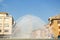 View of fountain Fontana Di Barriera Repubblica on the main street of Parma. Old catholic church Chiesa parrocchiale di San Sep