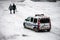 View of french municipal police car patrolling on the pedestrian place by snowy day